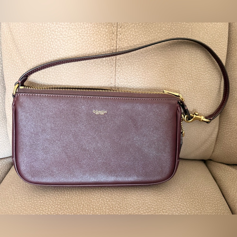 Coach Plaza bag in the color black currant.